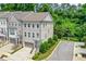 Beautiful three-story townhome with brick and painted siding and a two-car garage at 2187 Elmont Se Way, Smyrna, GA 30080