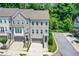 Beautiful three-story townhome with brick and painted siding and a two-car garage at 2187 Elmont Se Way, Smyrna, GA 30080