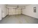 Spacious two-car garage with speckled epoxy flooring, overhead door, and drywall at 2187 Elmont Se Way, Smyrna, GA 30080