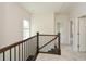 Hallway with carpet flooring, natural light, and access to additional rooms at 2187 Elmont Se Way, Smyrna, GA 30080
