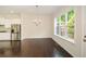 Open kitchen and dining area with stainless steel appliances, hardwood floors, and a view of the deck outside at 2187 Elmont Se Way, Smyrna, GA 30080