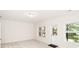 Bright room featuring ample sunlight and views of the surrounding greenery through its windows at 2187 Elmont Se Way, Smyrna, GA 30080