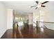Open-concept living room with hardwood floors and connecting kitchen and dining areas at 2187 Elmont Se Way, Smyrna, GA 30080
