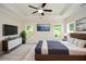 Spacious main bedroom boasts tray ceilings, ceiling fan, and a modern dresser at 2187 Elmont Se Way, Smyrna, GA 30080