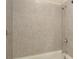 Close-up of a tiled shower featuring neutral-toned tile work and chrome fixtures, creating a clean, modern look at 2187 Elmont Se Way, Smyrna, GA 30080