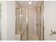 Close up of a tiled shower with a glass door and a built in bench at 2187 Elmont Se Way, Smyrna, GA 30080