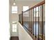 Interior staircase with dark wood treads, white risers, and black metal handrail, leading up to the next floor at 2187 Elmont Se Way, Smyrna, GA 30080