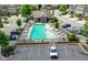 A beautiful view of a well-maintained community pool with lots of lounge chairs and parking spaces at 2187 Elmont Se Way, Smyrna, GA 30080