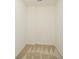 Empty walk-in closet features neutral paint and carpet at 2187 Elmont Se Way, Smyrna, GA 30080