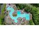 This overhead shot highlights a complex aquatic center with a pool, waterslide, and numerous lounging chairs at 232 Heron Pointe Vw, Canton, GA 30114