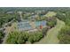 Aerial view of community amenities showcasing tennis courts, well-maintained landscaping, and proximity to green spaces at 232 Heron Pointe Vw, Canton, GA 30114