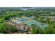 Aerial view of the community, including well-kept tennis courts, townhomes, and nearby Lake Allatoona at 232 Heron Pointe Vw, Canton, GA 30114