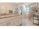 Bright bathroom with marble countertops, a double vanity, and a glass shower at 232 Heron Pointe Vw, Canton, GA 30114