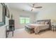 Bedroom with neutral tones, a view from the window, and stylish furniture at 232 Heron Pointe Vw, Canton, GA 30114