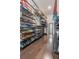 Spacious walk-in closet with custom shelving and hardwood floors at 232 Heron Pointe Vw, Canton, GA 30114