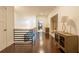 Bright hallway with hardwood floors, modern railing, and decorative furniture at 232 Heron Pointe Vw, Canton, GA 30114