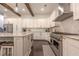 Modern kitchen with stainless steel appliances, white cabinetry, and a large granite island with barstool seating at 232 Heron Pointe Vw, Canton, GA 30114
