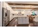 Open-concept kitchen with white cabinets, stainless steel appliances, and a large island at 232 Heron Pointe Vw, Canton, GA 30114