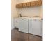 Efficient laundry room featuring modern washer, dryer, and storage at 232 Heron Pointe Vw, Canton, GA 30114