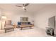 Cozy living room with a neutral-colored couch, TV, and modern decor at 232 Heron Pointe Vw, Canton, GA 30114