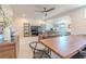 Bright living space with a wooden table, leather couch, and large windows at 232 Heron Pointe Vw, Canton, GA 30114
