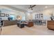 Open living space with a dining table, leather couch, and large windows at 232 Heron Pointe Vw, Canton, GA 30114