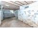 Unfinished basement with concrete walls and exposed wood ceiling, ready for customization and storage solutions at 2322 Paces Ferry Se Rd, Smyrna, GA 30080