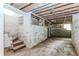 Spacious unfinished basement with potential for customization, featuring concrete walls and exposed ceiling at 2322 Paces Ferry Se Rd, Smyrna, GA 30080