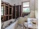 Bathroom in disrepair with a damaged tub, toilet, and walls at 2322 Paces Ferry Se Rd, Smyrna, GA 30080