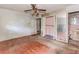 Bedroom requiring renovation, with damaged hardwood floors and walls at 2322 Paces Ferry Se Rd, Smyrna, GA 30080