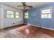 Bedroom featuring hardwood floors, windows, and two-tone wall paint at 2322 Paces Ferry Se Rd, Smyrna, GA 30080