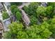 Aerial view of a home with a gray roof surrounded by many green trees at 380 Kendrick Se Ave, Atlanta, GA 30315