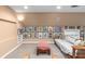 Basement lounging area with a large futon, accent furniture, and gallery wall at 380 Kendrick Se Ave, Atlanta, GA 30315