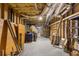 Unfinished basement featuring exposed beams and ductwork, perfect for customization and extra storage space at 380 Kendrick Se Ave, Atlanta, GA 30315