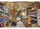 Unfinished basement with exposed ceiling, packed with exercise equipment and ample storage at 380 Kendrick Se Ave, Atlanta, GA 30315