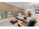Relaxing basement area with comfortable seating, bar and an eclectic gallery wall at 380 Kendrick Se Ave, Atlanta, GA 30315