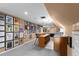 Finished basement featuring a large bar with seating and an eclectic gallery wall at 380 Kendrick Se Ave, Atlanta, GA 30315