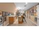 Basement wet bar features updated cabinets, tiled backsplash, sink and bar seating at 380 Kendrick Se Ave, Atlanta, GA 30315
