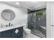 Bathroom features a sleek glass enclosed shower, designer vanity, and modern fixtures at 380 Kendrick Se Ave, Atlanta, GA 30315
