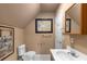 Cozy bathroom featuring a single sink, white tiled flooring, and decorative artwork at 380 Kendrick Se Ave, Atlanta, GA 30315