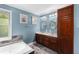Bathroom with a large soaking tub, glass enclosed shower, and dark wood cabinets at 380 Kendrick Se Ave, Atlanta, GA 30315