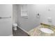 This bathroom features a granite countertop, a vessel sink, and tile floors at 380 Kendrick Se Ave, Atlanta, GA 30315