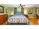Charming bedroom featuring hardwood floors, a ceiling fan, and ample natural light from the window at 380 Kendrick Se Ave, Atlanta, GA 30315