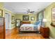 Relaxing bedroom showcases hardwood floors, green walls, and natural light, creating a peaceful retreat at 380 Kendrick Se Ave, Atlanta, GA 30315