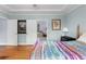 Bedroom boasts hardwood floors, neutral paint, and a doorway to another room at 380 Kendrick Se Ave, Atlanta, GA 30315