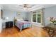 Bedroom features a ceiling fan, neutral paint, hardwood floors, and natural light at 380 Kendrick Se Ave, Atlanta, GA 30315
