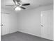 This bedroom features a neutral color scheme, ceiling fan with light fixture, and carpeted floor at 380 Kendrick Se Ave, Atlanta, GA 30315