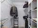 Walk-in closet with white shelving and hanging storage providing ample organization space at 380 Kendrick Se Ave, Atlanta, GA 30315