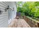 Inviting wooden deck with ample space and a view of the surrounding trees, ideal for outdoor gatherings at 380 Kendrick Se Ave, Atlanta, GA 30315