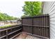 This outdoor deck features brown wooden railings and string lights at 380 Kendrick Se Ave, Atlanta, GA 30315